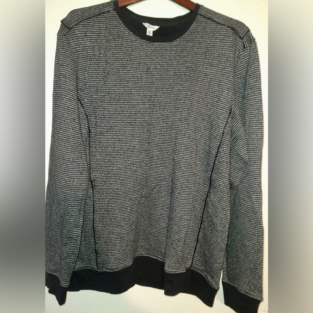 Beautiful Calvin Klein sweater. With leather detailing.